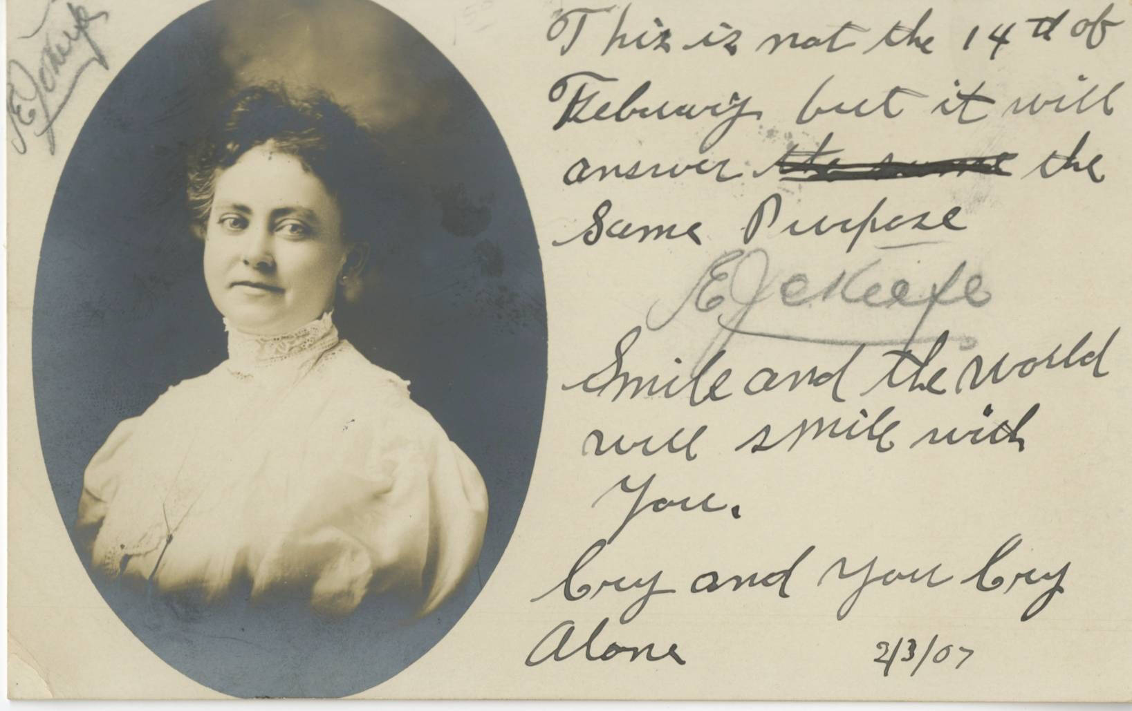 Black and white real photo postcard with a portrait of a woman in an oval shape, handwritten message around the photograph.